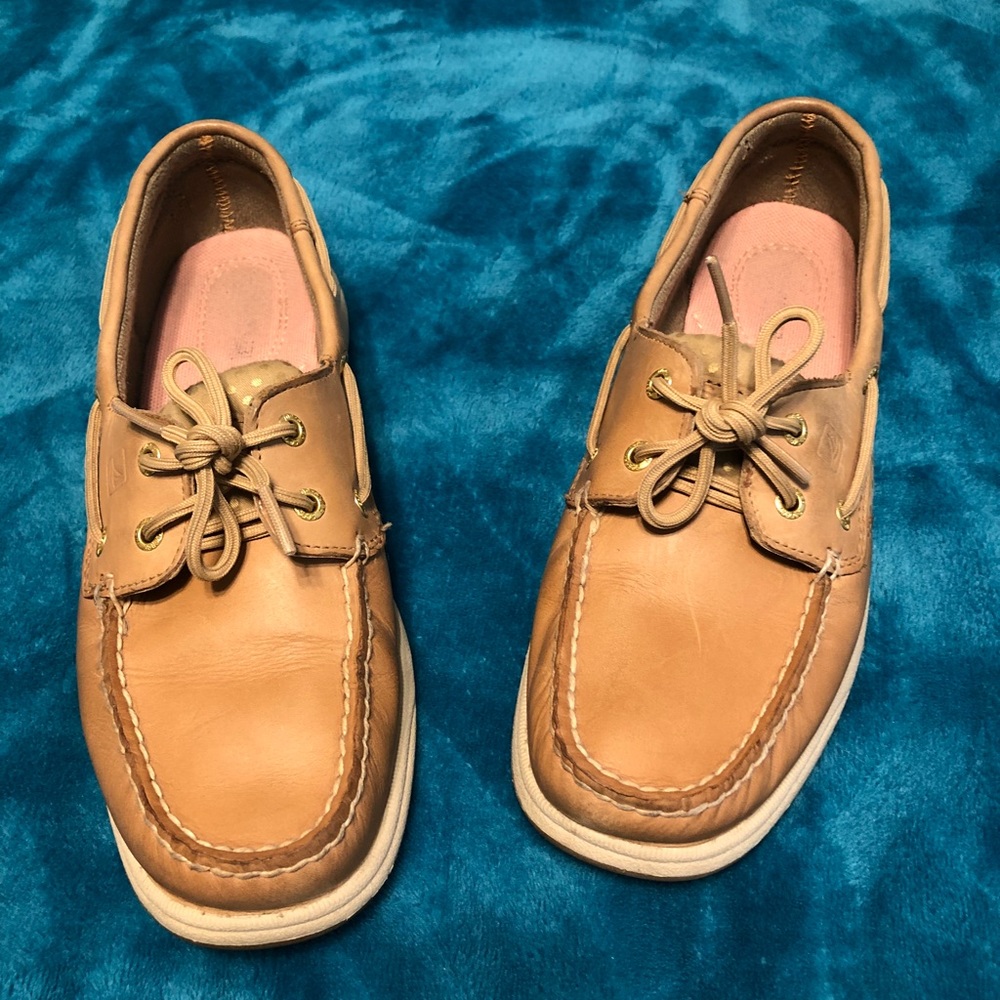 Tan colored Sperrys.